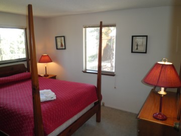 master bedroom, queen bed, linens, towels, dresser, closet, lamps