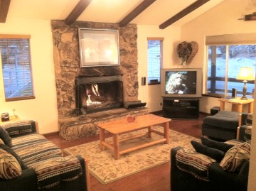 Living Room, with comfortable furnigure, wood burning fireplace, large TV w/Cable-DVR, DVD Player, and Stereo